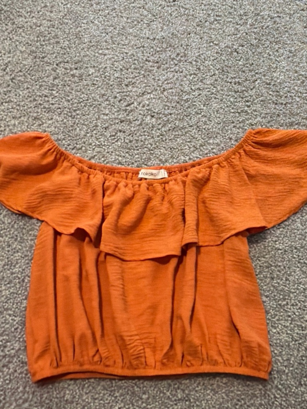 Off-Shoulder Ruffle Crop Top in Burnt Orange by Tokoko